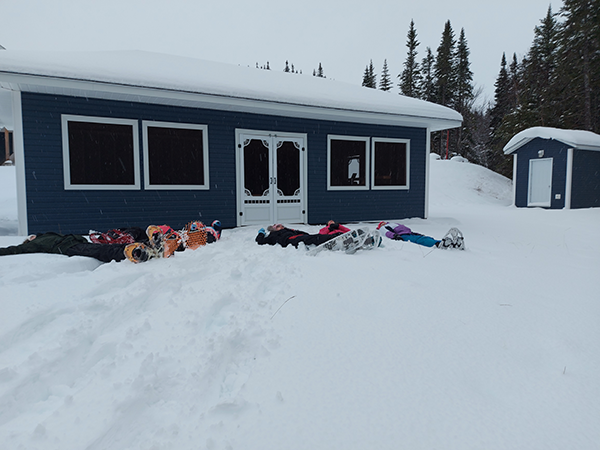 lying in the snow